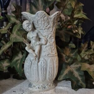 Elegant Cream Ceramic Vase with Cherub Design